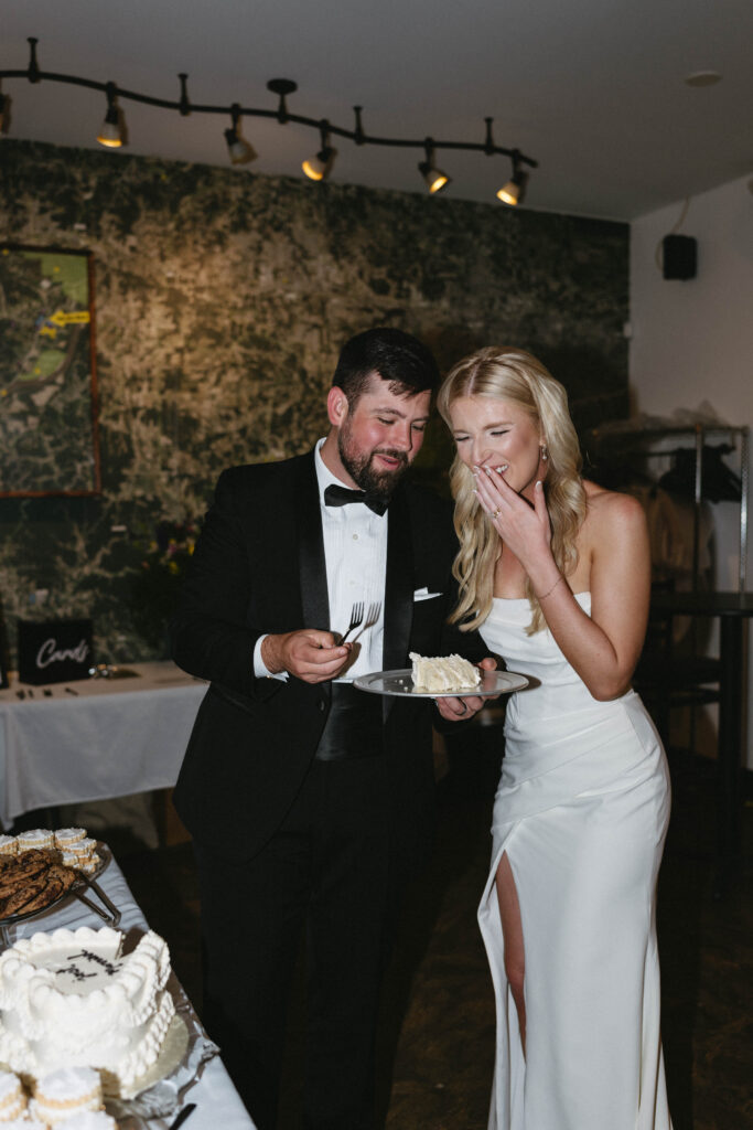 bride and groom cutting cake candid moment